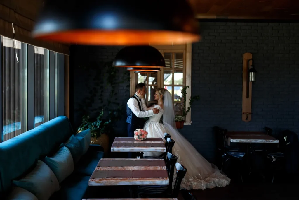 A picture of a bride and groom in their favorite restaurant.