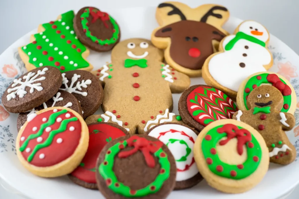 A platter of differently decorated Christmas cookies.