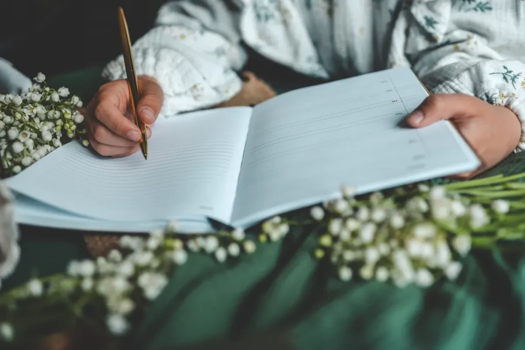 Someone about to write in a guestbook.