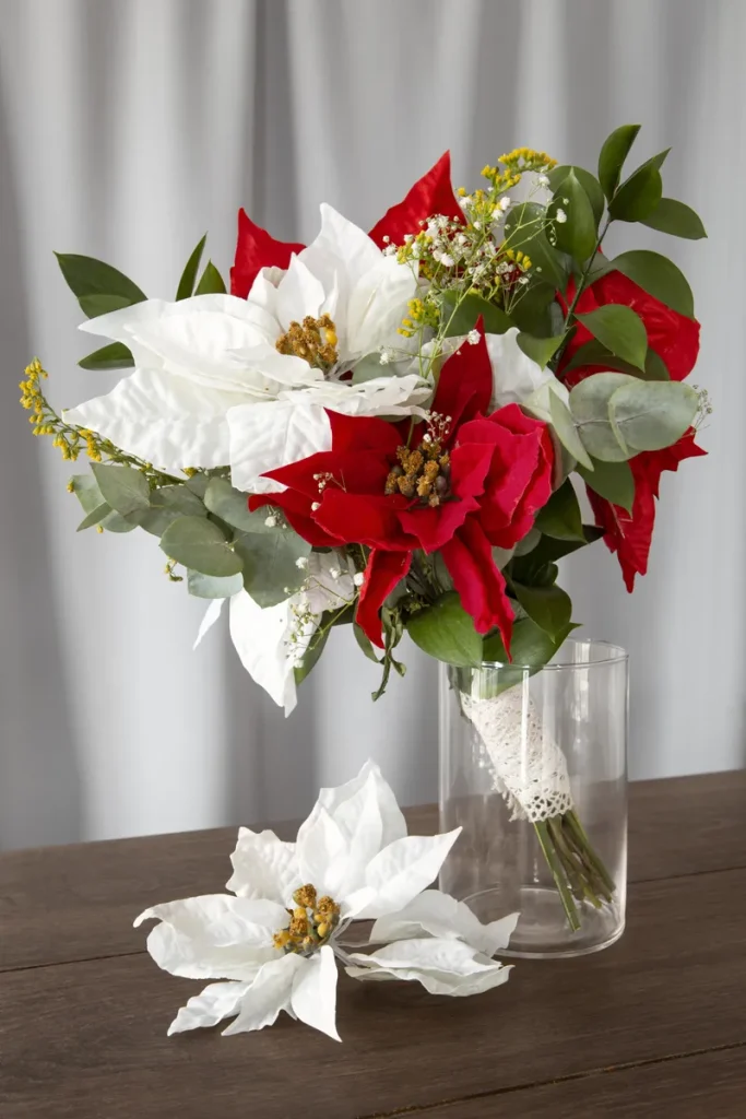 A floral bouquet with white and red poinsettia's.