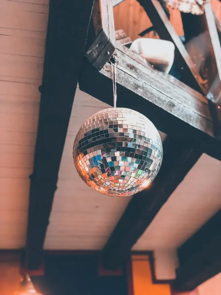 A disco ball hanging from a loft.