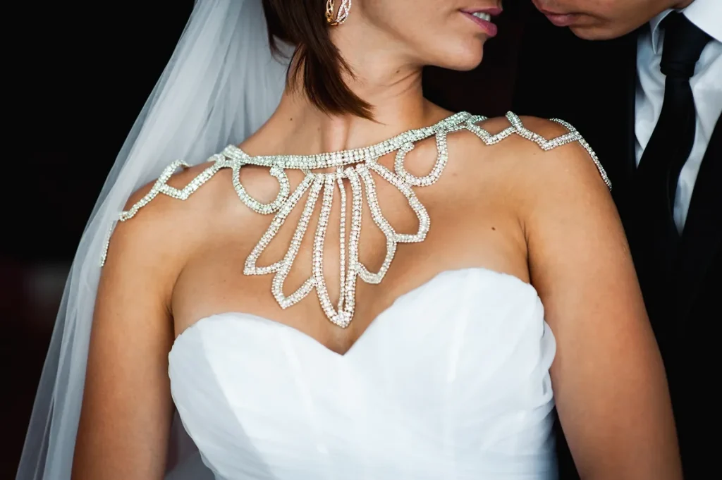 A bold statement necklace that extends off the shoulders.